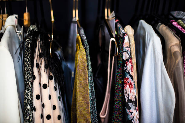 Close up of chic clothing on clothing rack.